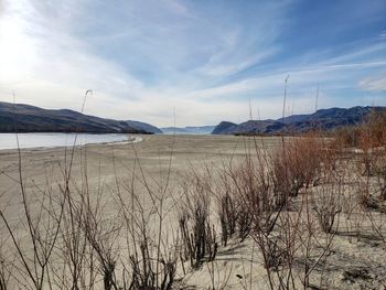 Scenic view of land against sky during winter