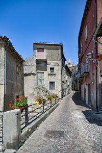A narrow street between the old houses of marsicovetere, a village of potenza province, italy.