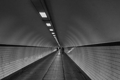 Walkway in illuminated corridor