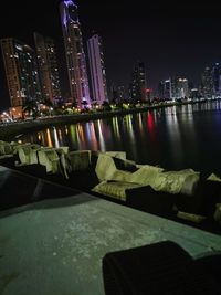 Illuminated city at waterfront