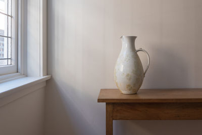 White vase on table at home