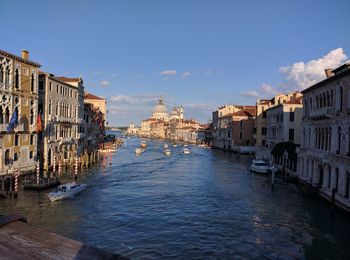 Canal amidst buildings in city