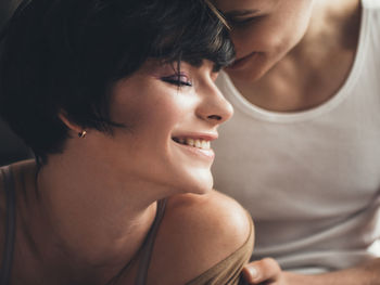 Close-up portrait of a smiling young woman