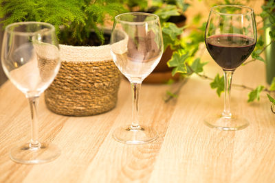 Close-up of wine glasses on table