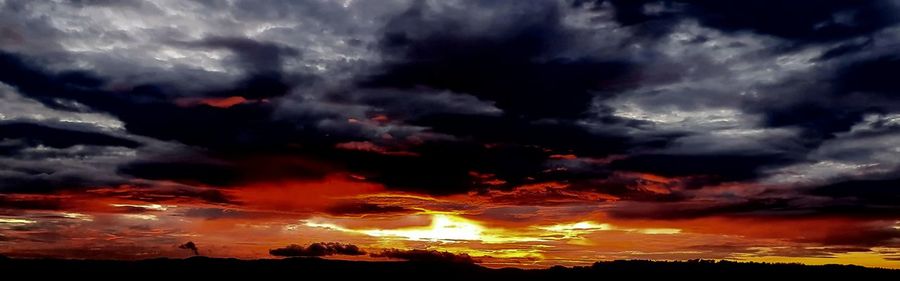 Scenic view of dramatic sky during sunset