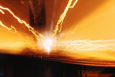 Light trails against sky at night