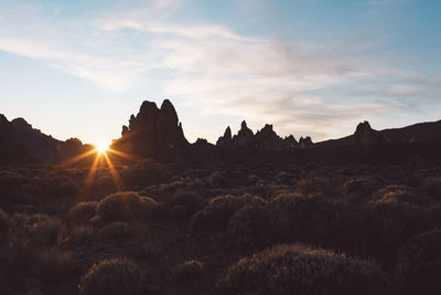 Panoramic view of silhouette landscape against sky during sunset