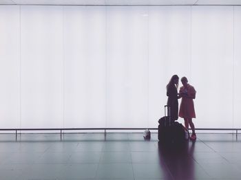 Women standing at airport