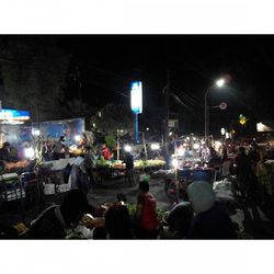 People on city street at night