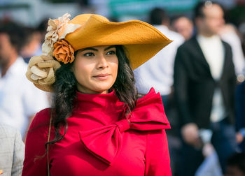 Portrait of young woman wearing hat