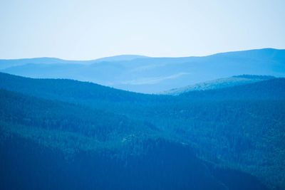 Scenic view of mountains against clear blue sky