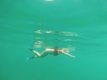 Woman swimming in sea