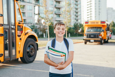 Portrait of smiling man on street in city