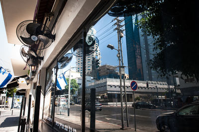Low angle view of street lights in city
