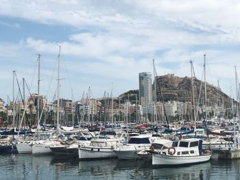 Sailboats moored in sea