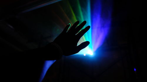 Close-up of hand holding illuminated light