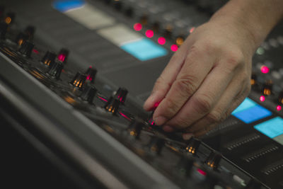 Cropped image of man using sound mixer