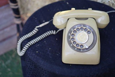 High angle view of old telephone on table