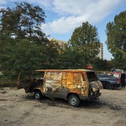 Abandoned van by trees