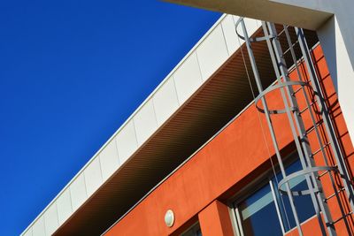 Low angle view of building against clear blue sky