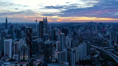 Aerial view of city buildings during sunset