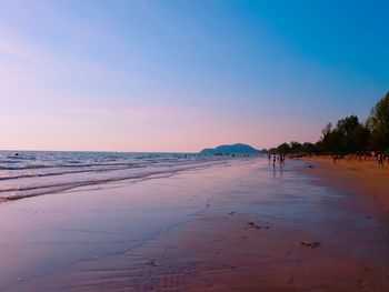 Scenic view of beach against sky during sunset