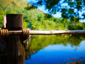 Close-up of wooden fence against blue sky