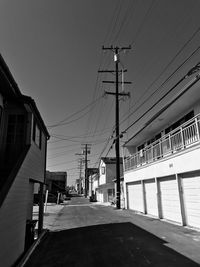 Road amidst buildings against sky in city san diego mission beach walkway at the beach 