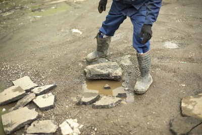 Worker carries stone. cleaning of construction waste. broken stone. 