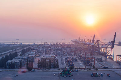 Panoramic view of city against sky during sunset