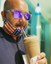 Portrait of man drinking glass