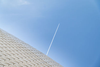 Low angle view of building against blue sky