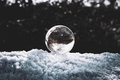 Close-up of crystal ball in winter