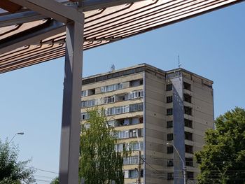 Low angle view of buildings against blue sky