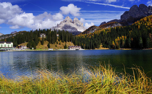 Scenic view of lake and mountains against sky