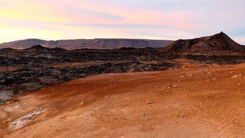 Scenic view of landscape against sky during sunset
