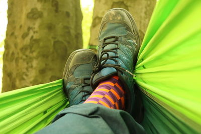 Low section of man wearing shoes