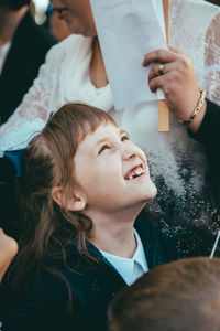 Smiling girl looking up outdoors