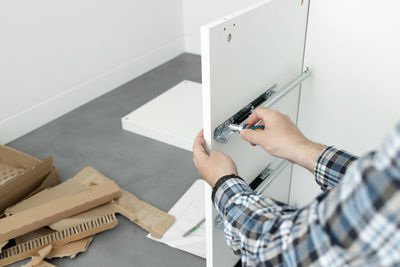 High angle view of man working on table