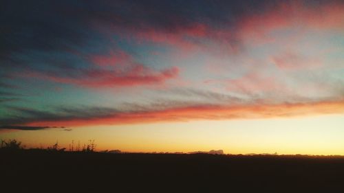 Scenic view of dramatic sky during sunset