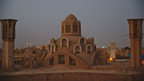 Historic building traditional mosque in desert against sky