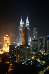 Illuminated buildings in city at night