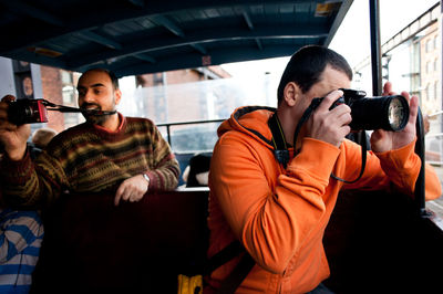 High angle view of man traveling in train