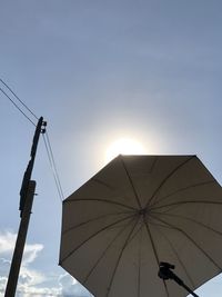 Low angle view of cables against sky during sunset