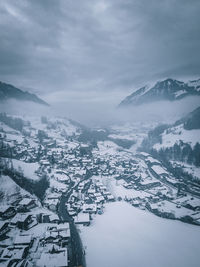 Aerial view of snowcapped mountains against sky