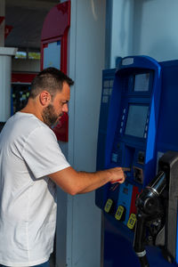 Side view of man working in workshop