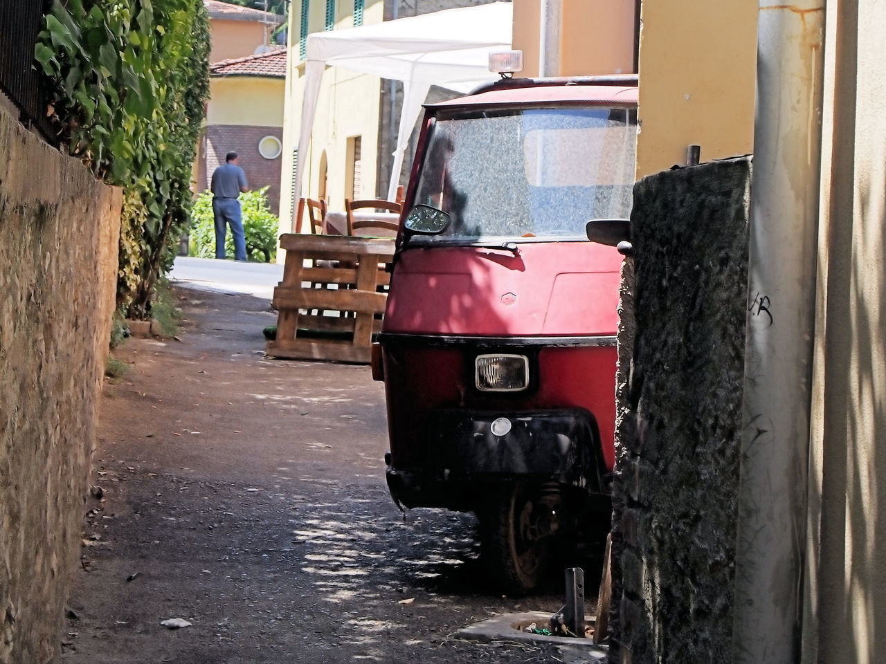 CAR ON STREET BY BUILDING