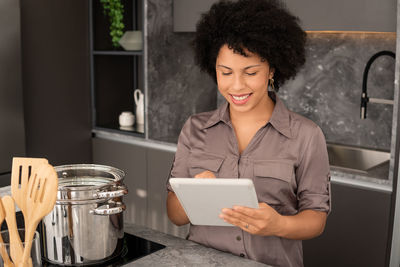 Young woman using laptop at home