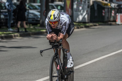 Man riding bicycle on road