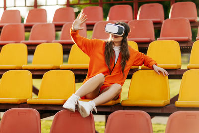 A young athlete wearing virtual reality glasses, dressed in sportswear